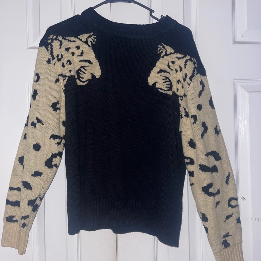 Angashion black crocheted Cheetah sleeve sweater